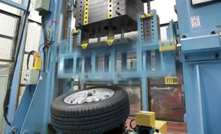 A tire being worked on the machine