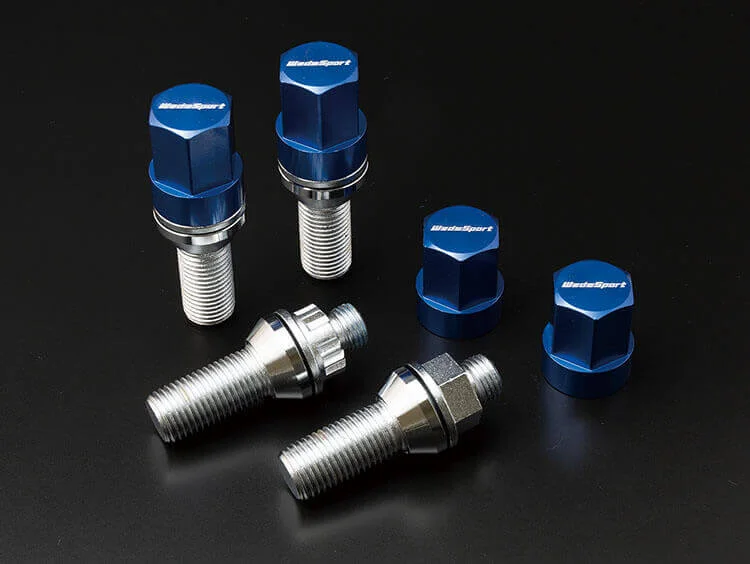 A group of blue and silver car tire valves.