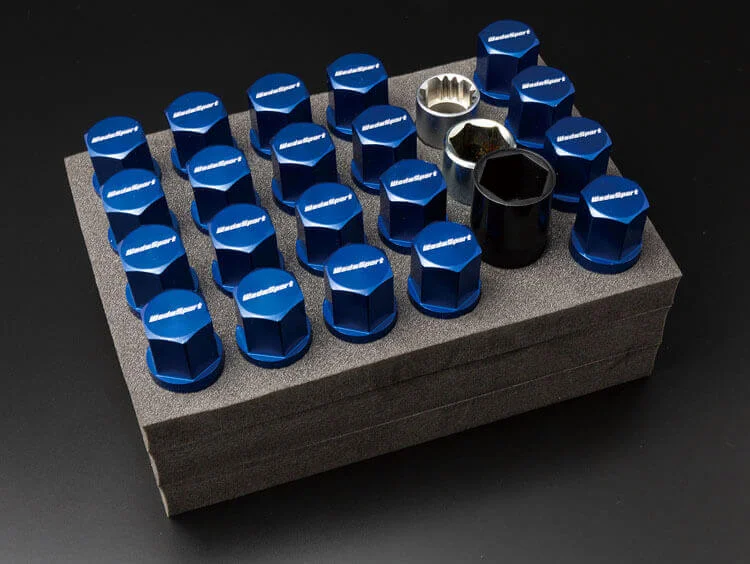 A set of blue nuts and bolts on top of a table.