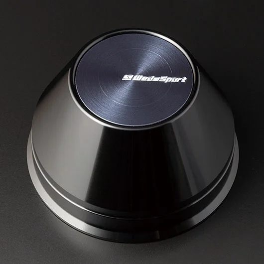 A black knob with the word " motorsport " on it.