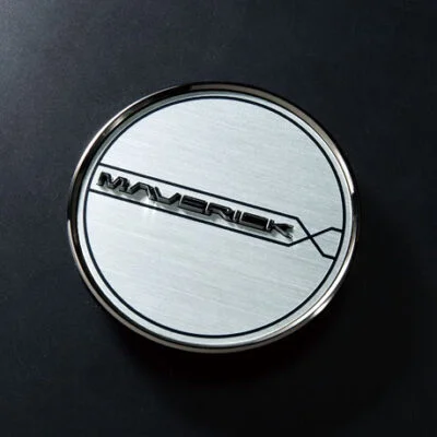 A white and black logo on a round metal object.