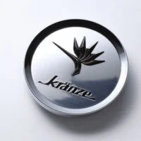 A silver button with the word " krinku ".
