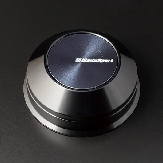 A black button with the word blackstar on it.