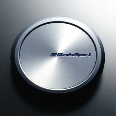 A metal disc with the word bladesport on it.