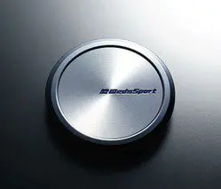 A silver button with the word bluesport on it.