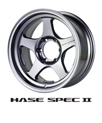 A silver wheel with the words hase spec ii underneath it.